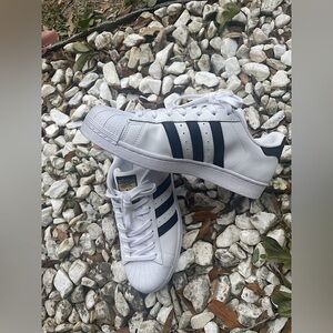 Adidas Superstars, Never Been Worn, Size 9.5. Color White with Black Striping